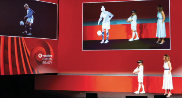 Despite being more than 190 miles away, 11-year-old Iris was able to use 5G and a VR headset to realise her dream of being with her idol, Manchester City and England Women’s captain Stephanie Houghton. Pictured right is Vodafone enterprise director, Anne Sheehan.